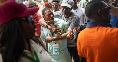 Security officers and voters at a Kano polling unit during by-elections
